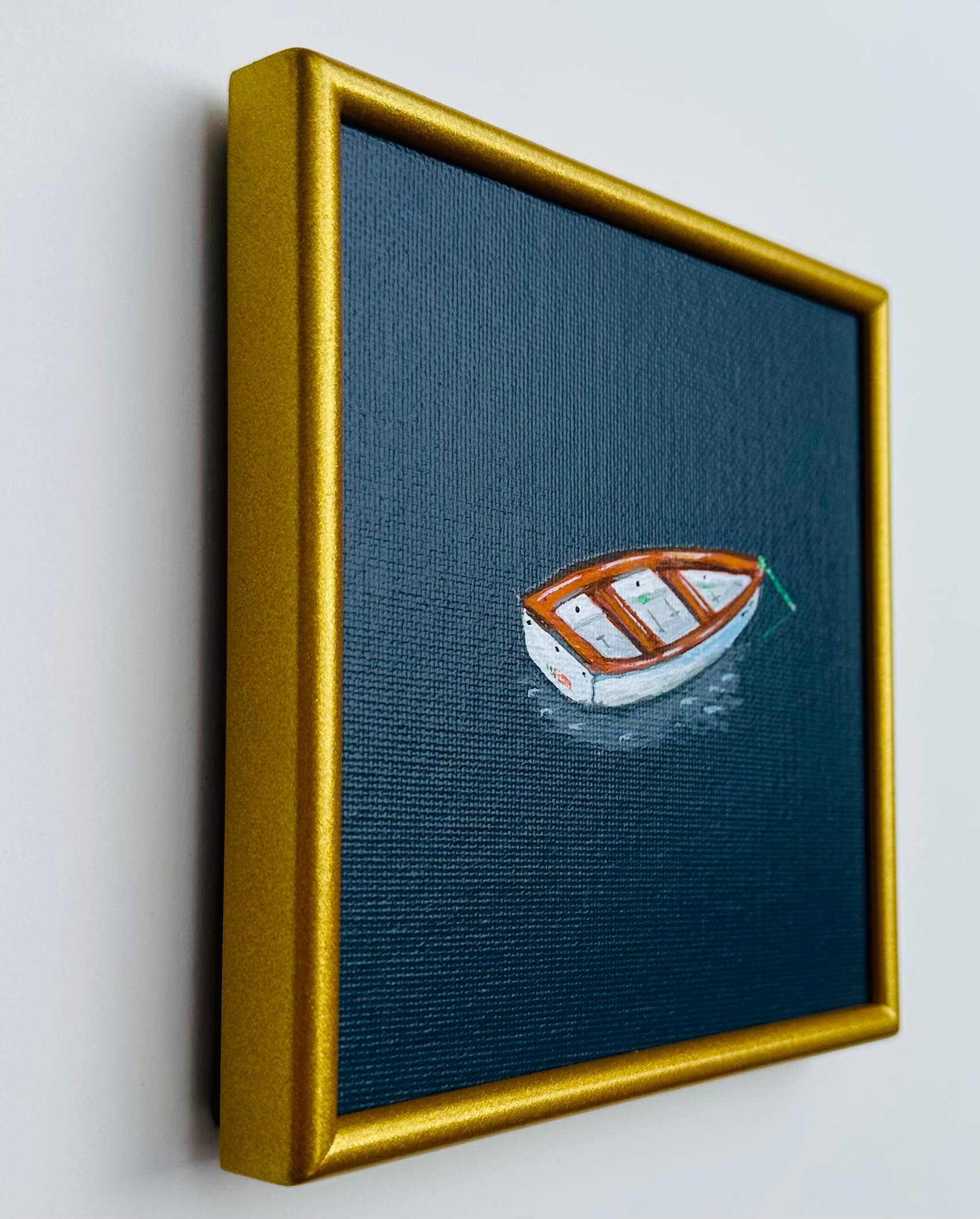 Little Rowboat in Dark Blue Water