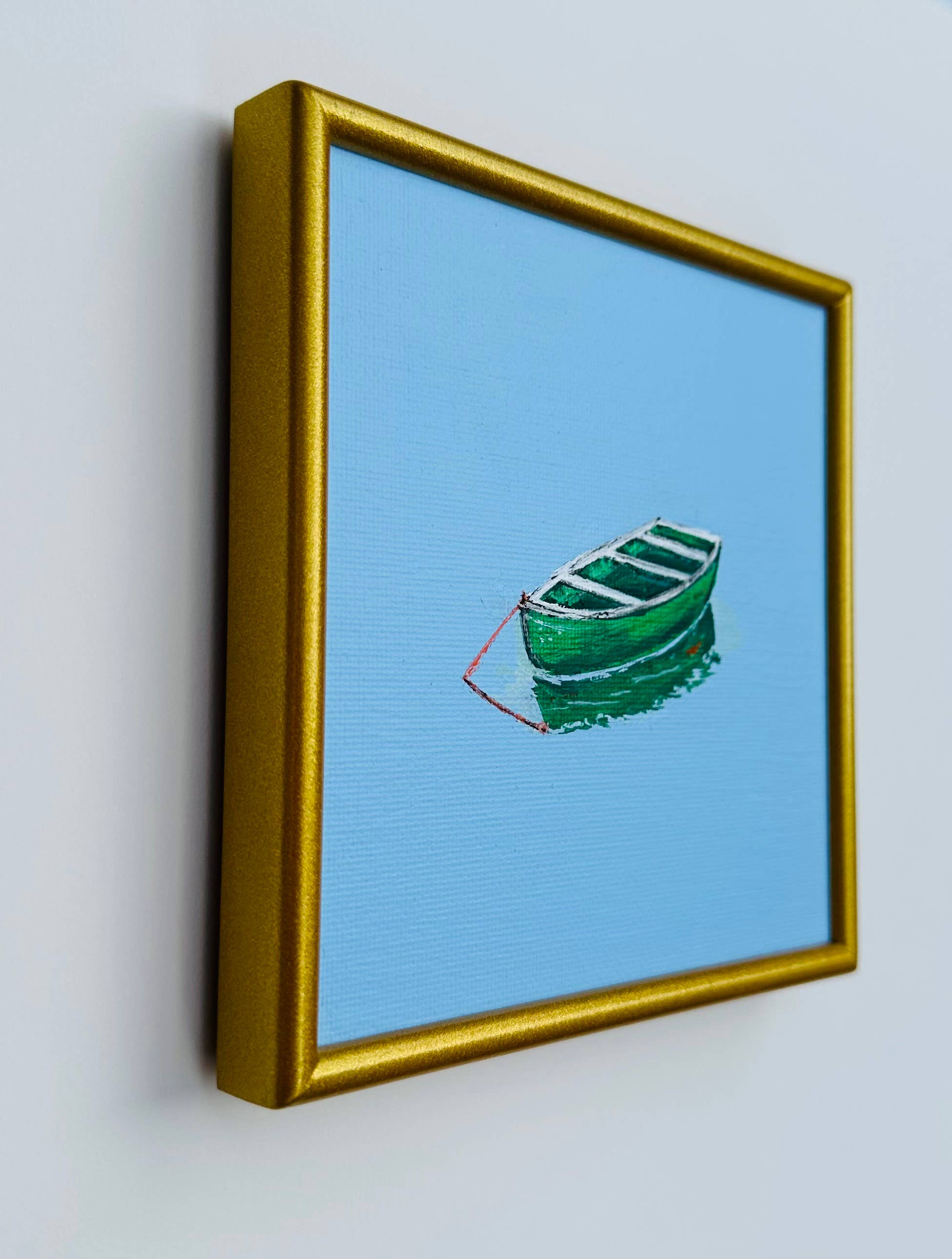 Little Green Rowboat in Blue Waters