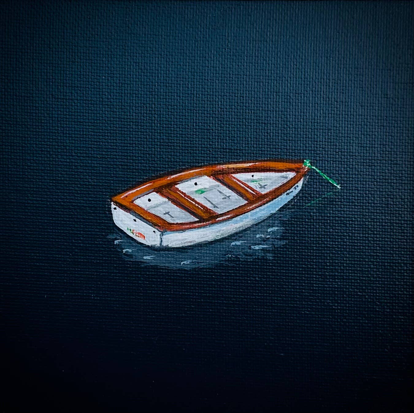 Little Rowboat in Dark Blue Water
